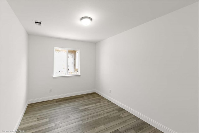 spare room with light hardwood / wood-style flooring