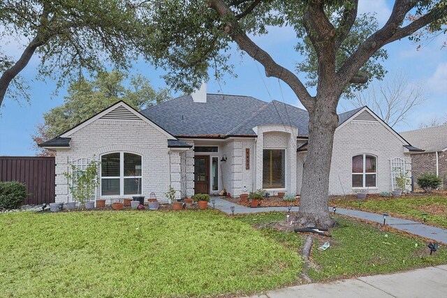 view of front of home with a front lawn