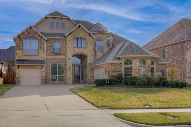 view of front of property with concrete driveway, a front yard, stone siding, and a standing seam roof