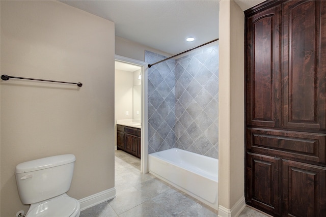 full bathroom featuring tile patterned flooring, vanity, toilet, baseboards, and shower / tub combination