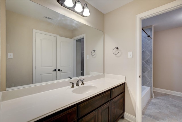 full bath featuring baseboards, visible vents, bathing tub / shower combination, and vanity