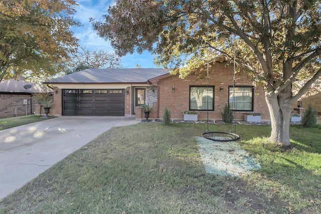 ranch-style house featuring a garage, driveway, a front lawn, and brick siding