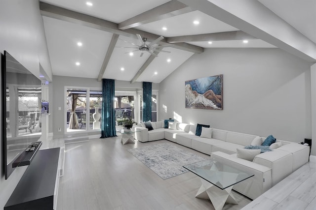 living room featuring beam ceiling, ceiling fan, light hardwood / wood-style flooring, and high vaulted ceiling