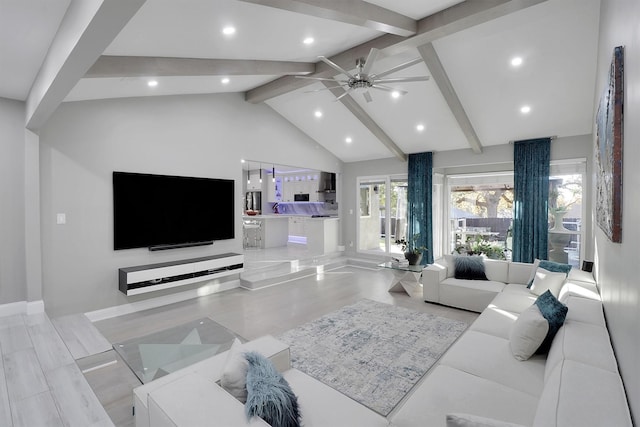 living room featuring ceiling fan, beamed ceiling, light hardwood / wood-style floors, and high vaulted ceiling