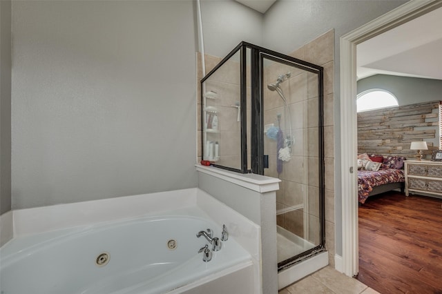 bathroom featuring tile patterned flooring and independent shower and bath