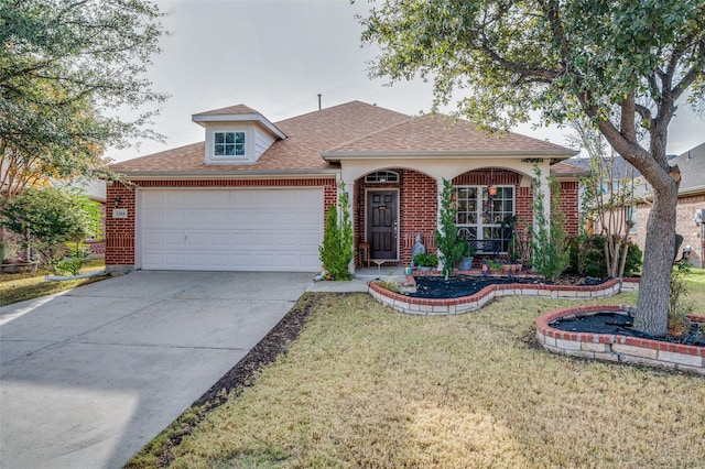 view of front of home with a garage and a front yard