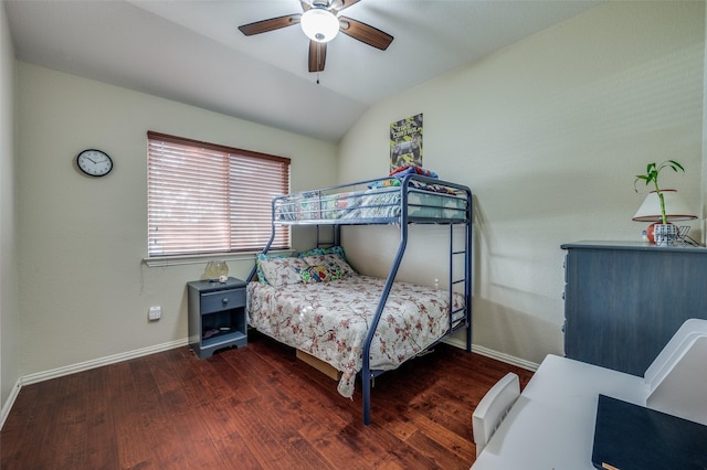 bedroom featuring vaulted ceiling, dark hardwood / wood-style floors, and ceiling fan