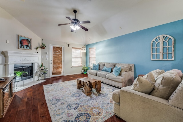 living room with ceiling fan, dark hardwood / wood-style flooring, and vaulted ceiling