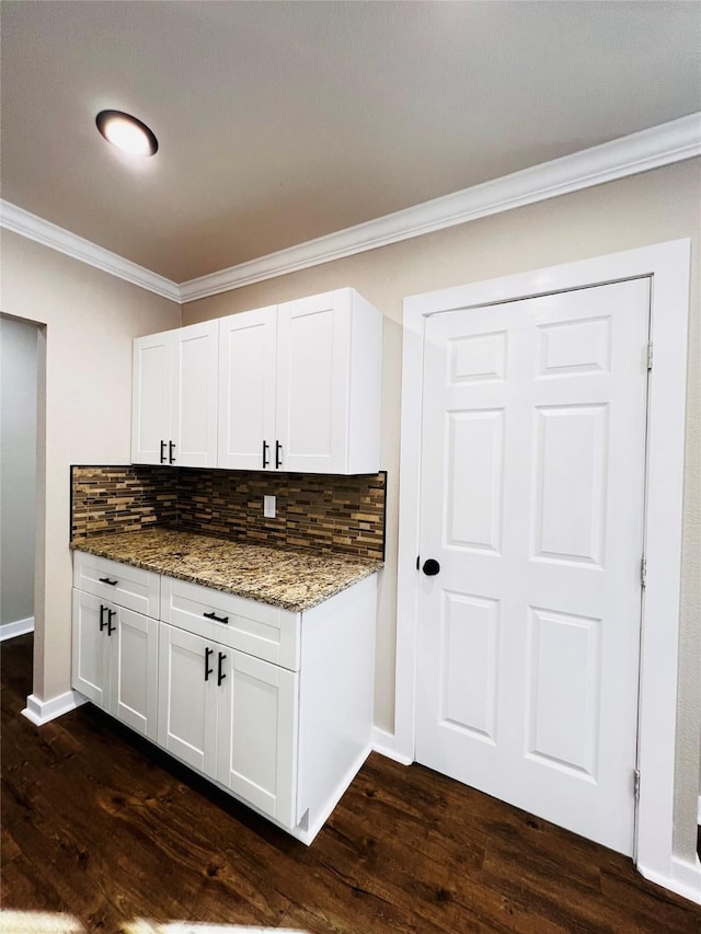 1601 Ficklin Ave, Corsicana, TX 75110 - kitchen with stone countertops, tasteful backsplash, dark wood-style flooring, and crown molding