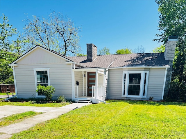 1601 Ficklin Ave, Corsicana, TX 75110 - ranch-style home with a front lawn, a porch, a shingled roof, and a chimney