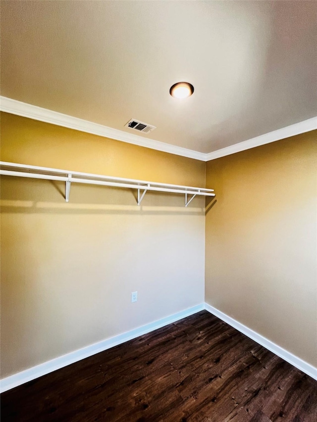 1601 Ficklin Ave, Corsicana, TX 75110 - spacious closet with visible vents and dark wood-style floors