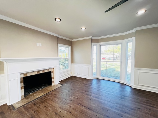 1601 Ficklin Ave, Corsicana, TX 75110 - unfurnished living room with dark wood-type flooring, recessed lighting, wainscoting, and a fireplace