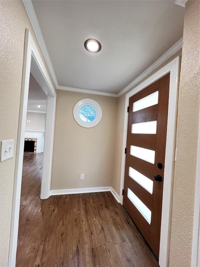 entrance foyer with crown molding and dark wood-type flooring