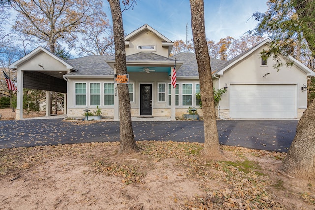 view of front of home featuring a carport, a garage, and ceiling fan