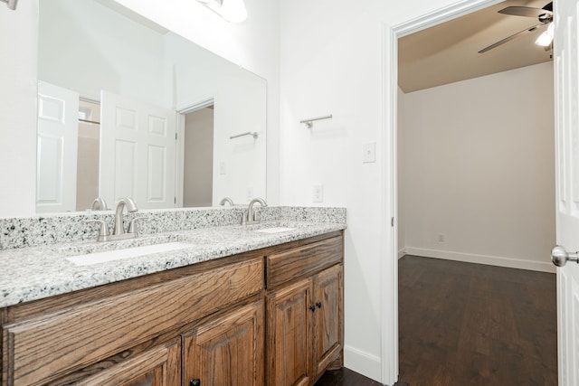 bathroom featuring vanity, wood-type flooring, and ceiling fan