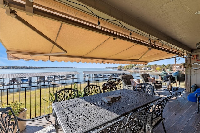 view of patio featuring a deck with water view