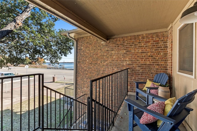 balcony featuring a water view