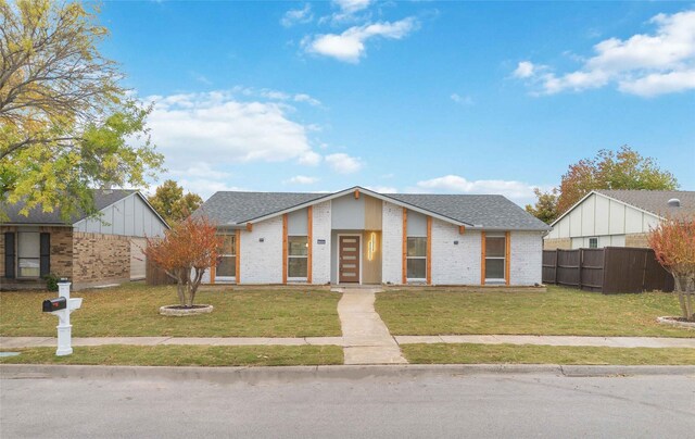 122 Lucinda Dr, Garland, TX 75040 - view of front of property with a front lawn