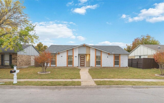 view of front of property with a front lawn