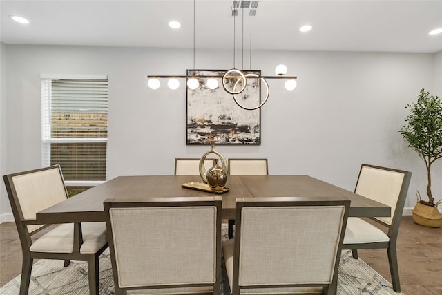 dining space featuring hardwood / wood-style flooring