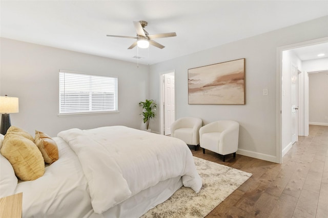 bedroom with ceiling fan and hardwood / wood-style floors