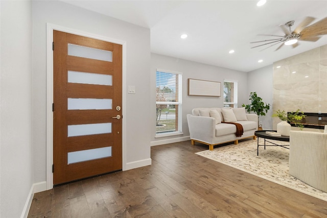 foyer with hardwood / wood-style flooring and ceiling fan