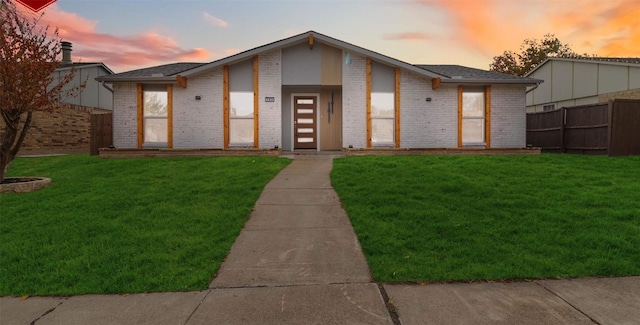 view of front of house with a yard