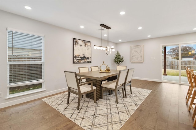 dining space with light hardwood / wood-style flooring