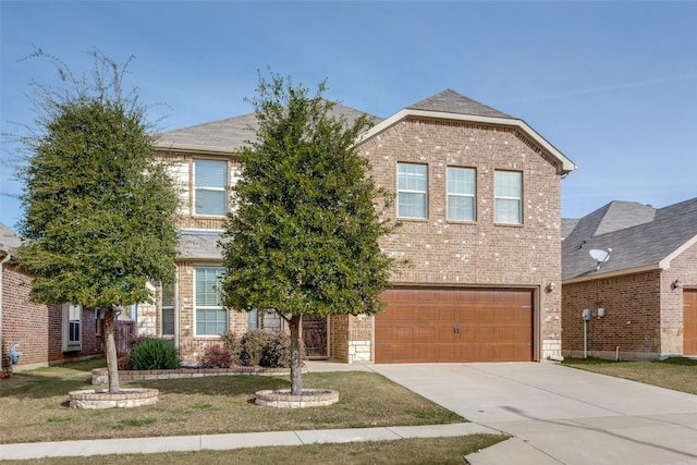 front of property with a front yard and a garage