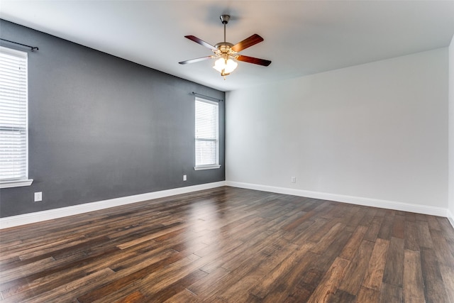 unfurnished room featuring dark hardwood / wood-style flooring and ceiling fan