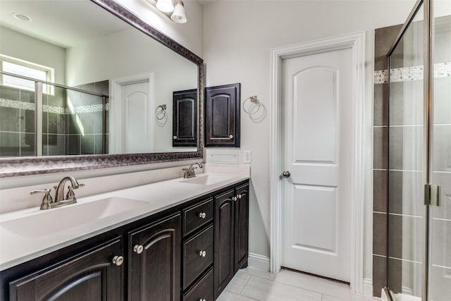 bathroom with vanity, tile patterned flooring, and walk in shower