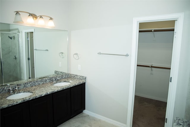 bathroom with vanity and walk in shower