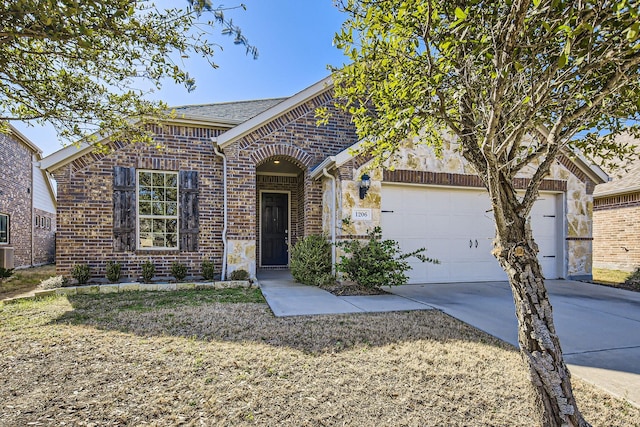 view of front of house featuring a garage, brick siding, and concrete driveway