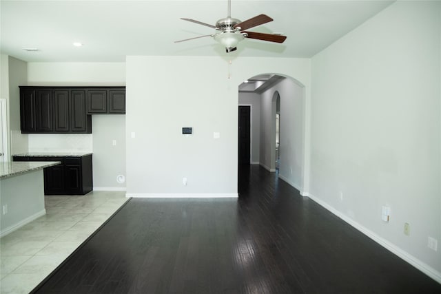 unfurnished living room with light hardwood / wood-style flooring and ceiling fan