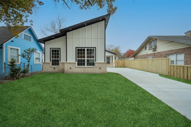 back of house with a yard