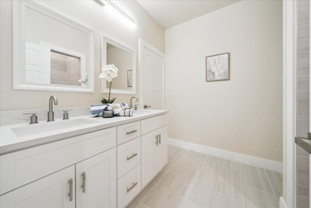 bathroom with tile patterned flooring and vanity