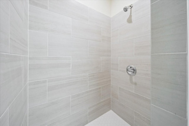 bathroom with tiled shower