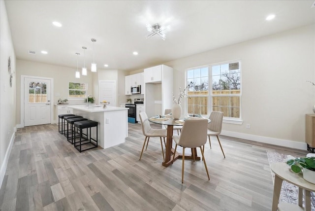 dining room featuring light hardwood / wood-style flooring