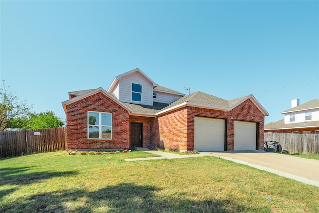 view of front of property featuring a front yard and a garage