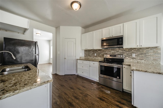 kitchen with dark hardwood / wood-style floors, white cabinetry, and appliances with stainless steel finishes