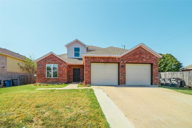 view of front facade featuring a garage and a front yard