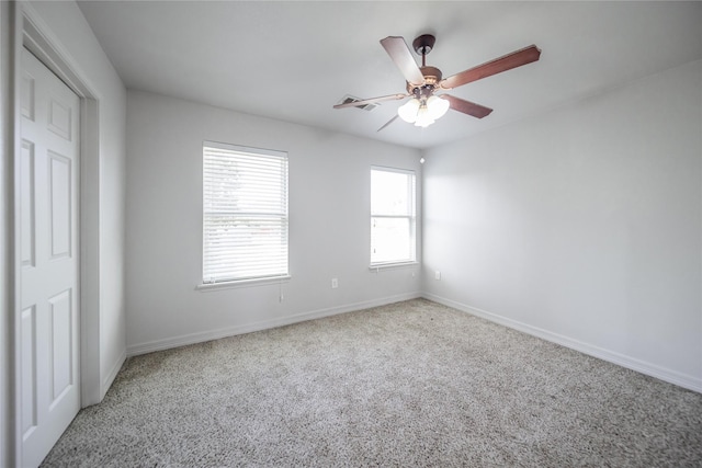 unfurnished bedroom with carpet flooring and ceiling fan