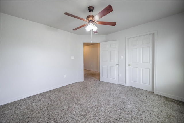 unfurnished bedroom featuring ceiling fan and carpet floors