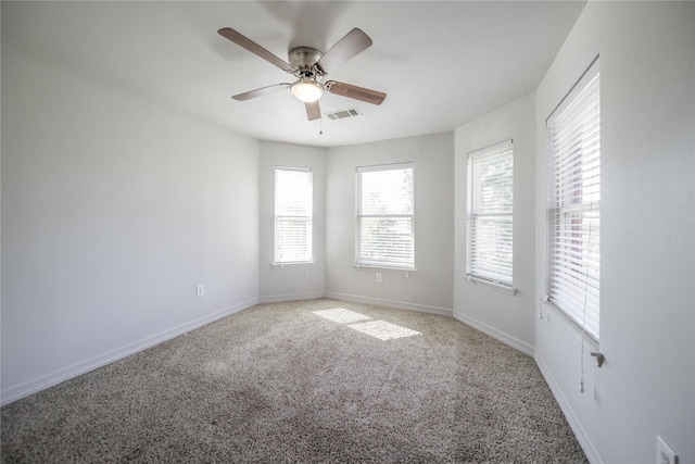 unfurnished room featuring carpet and ceiling fan