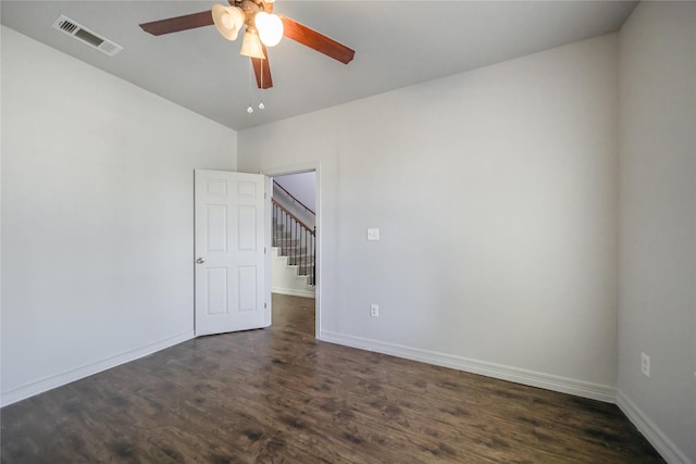 unfurnished room featuring dark hardwood / wood-style floors and ceiling fan