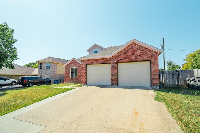 view of front of property featuring a garage and a front yard