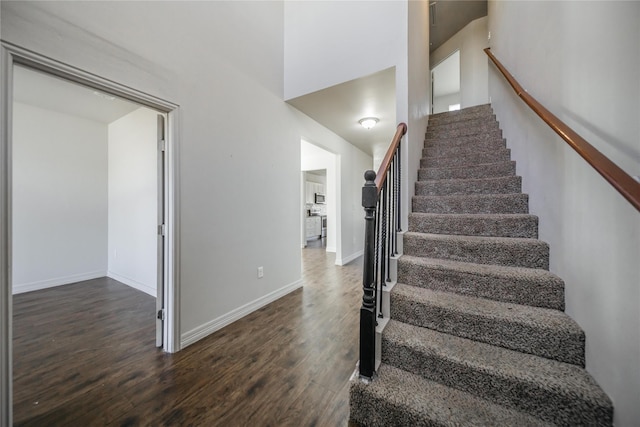 staircase with wood-type flooring