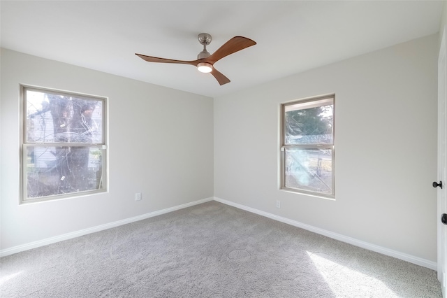 spare room with ceiling fan and carpet floors