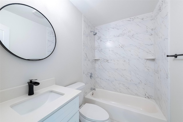 full bathroom featuring toilet, vanity, and tiled shower / bath