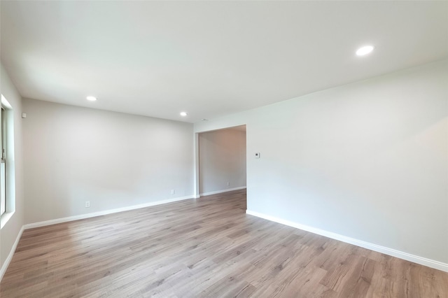 spare room with light hardwood / wood-style floors